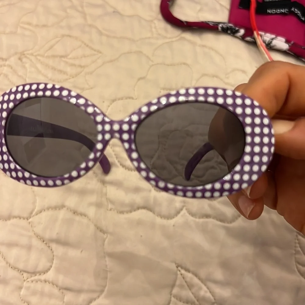 Two little girls sunglasses used in good shape pink and purple